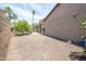 View of the side yard with desert landscaping, and patio cover at 16772 W Cypress St, Goodyear, AZ 85395
