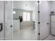 Light-filled bathroom with double doors leading to shower, vanity, and storage at 16772 W Cypress St, Goodyear, AZ 85395