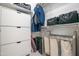 Storage closet showing shelves, drawers, and laundry hamper at 16772 W Cypress St, Goodyear, AZ 85395