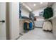 Open closet with racks and shelves for storage at 16772 W Cypress St, Goodyear, AZ 85395