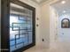 Modern entryway with decorative front door and tile flooring at 16772 W Cypress St, Goodyear, AZ 85395