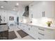Bright kitchen with sleek white cabinetry, modern appliances, and beautiful countertops providing ample workspace at 16772 W Cypress St, Goodyear, AZ 85395