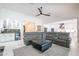 A modern living area features a stylish bar and a large sectional, perfect for entertaining at 16772 W Cypress St, Goodyear, AZ 85395