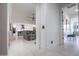 Hallway view of the living space with open layout to the kitchen, offering connectivity and flow at 16772 W Cypress St, Goodyear, AZ 85395