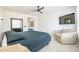 Well-lit primary bedroom with tiled floors, seating, and elegant furnishings at 16772 W Cypress St, Goodyear, AZ 85395