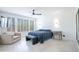 Spacious main bedroom featuring tiled floors, a ceiling fan, and abundant natural light at 16772 W Cypress St, Goodyear, AZ 85395