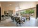 Spacious covered patio offers plush seating, ceiling fan, and easy access to the lush backyard for serene enjoyment at 16772 W Cypress St, Goodyear, AZ 85395
