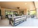 Inviting covered patio with comfortable seating overlooks a serene backyard, perfect for relaxation and entertainment at 16772 W Cypress St, Goodyear, AZ 85395