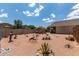 Large backyard with decorative landscaping and comfortable shaded patio furniture at 1680 E Cardinal Dr, Casa Grande, AZ 85122