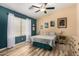 Serene bedroom with natural light, featuring a queen-sized bed and stylish decor at 1680 E Cardinal Dr, Casa Grande, AZ 85122
