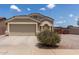 Charming single-Gathering home featuring a two-car garage, desert landscaping, and a well-maintained exterior at 1680 E Cardinal Dr, Casa Grande, AZ 85122