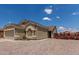 Inviting single-story home with a two-car garage, easy care landscaping, and a well-maintained facade at 1680 E Cardinal Dr, Casa Grande, AZ 85122