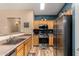 Contemporary kitchen with stainless steel appliances, plenty of counter space, and light wood cabinetry at 1680 E Cardinal Dr, Casa Grande, AZ 85122