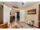 Inviting living room featuring wood floors, a ceiling fan, and double-door entryways at 1680 E Cardinal Dr, Casa Grande, AZ 85122