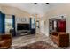 Spacious living room features wood-look floors, neutral walls, a ceiling fan and multiple windows offering lots of light at 1680 E Cardinal Dr, Casa Grande, AZ 85122
