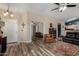 Cozy living room featuring hardwood floors, natural light, and comfortable leather furniture at 1680 E Cardinal Dr, Casa Grande, AZ 85122
