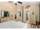 Spacious main bedroom with hardwood floors, plenty of closet space, and a ensuite bathroom at 1680 E Cardinal Dr, Casa Grande, AZ 85122
