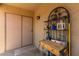 Covered patio area with shelving, an exterior door, and a tiled floor, offering an inviting outdoor space at 1680 E Cardinal Dr, Casa Grande, AZ 85122