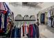 Spacious walk-in closet with ample storage, featuring metal shelving and hanging rods for organized wardrobe at 1680 E Cardinal Dr, Casa Grande, AZ 85122