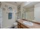 Bathroom with a neutral paint, a framed seashell art, and a framed mirror at 1769 E Jacob St, San Tan Valley, AZ 85140