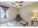 Bedroom with a window, comfortable chair, and glass coffee table at 1769 E Jacob St, San Tan Valley, AZ 85140