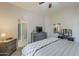 Main bedroom with ensuite bathroom featuring a queen bed with side tables at 1769 E Jacob St, San Tan Valley, AZ 85140