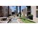 Scenic community with flowing water features, mature trees, and well-manicured grounds at 205 N 74Th St # 166, Mesa, AZ 85207