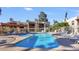 Inviting community pool area with plenty of lounge chairs and a hot tub at 205 N 74Th St # 166, Mesa, AZ 85207