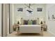 Stylish bedroom with dinosaur-themed wallpaper and a modern chandelier at 20901 S 231St Way, Queen Creek, AZ 85142