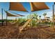 playground with slides, swings, and seating in a community park at 20901 S 231St Way, Queen Creek, AZ 85142