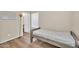 Serene bedroom offers wood-look flooring, natural light from the windows, and a calming atmosphere at 2118 N 77Th Ln, Phoenix, AZ 85035
