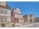 Attractive three-story house featuring stone veneer, a tiled roof, well-kept landscaping, and a inviting front entrance at 2118 N 77Th Ln, Phoenix, AZ 85035
