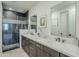 Bathroom showcasing a large double sink vanity, and a modern glass-enclosed shower at 2121 W Sonoran Desert Dr # 32, Phoenix, AZ 85085