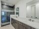 Luxurious bathroom features a glass-enclosed shower, dual sinks, and modern finishes at 2121 W Sonoran Desert Dr # 32, Phoenix, AZ 85085