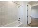 Bright bathroom featuring tiled shower, modern fixtures, and accessible tub at 2121 W Sonoran Desert Dr # 32, Phoenix, AZ 85085