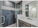 Sleek bathroom boasts a glass shower, dark tiling, and quartz countertops at 2121 W Sonoran Desert Dr # 32, Phoenix, AZ 85085