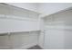 A walk-in closet with custom shelving and ample storage space at 2121 W Sonoran Desert Dr # 32, Phoenix, AZ 85085