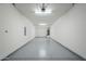 Spacious two-car garage with epoxy flooring and overhead lighting at 2121 W Sonoran Desert Dr # 32, Phoenix, AZ 85085