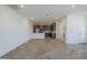 Bright, open-concept living space with stylish floors seamlessly connected to the kitchen area at 2121 W Sonoran Desert Dr # 32, Phoenix, AZ 85085