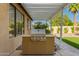 Outdoor built-in grill on covered patio with easy access to the turf backyard at 2183 W Hawken Way, Chandler, AZ 85286