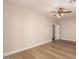 Spacious bedroom with ceiling fan and neutral walls complemented by modern baseboards and wood-look floors at 2183 W Hawken Way, Chandler, AZ 85286