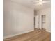 Spacious bedroom with a walk-in closet, neutral walls, and wood-look flooring at 2183 W Hawken Way, Chandler, AZ 85286