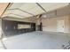 Spacious garage with epoxy flooring, storage cabinets, work bench, and hanging storage racks at 2183 W Hawken Way, Chandler, AZ 85286