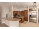 Gourmet kitchen boasting granite counters, island, stainless appliances, and custom cabinetry at 2183 W Hawken Way, Chandler, AZ 85286