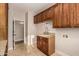 Well-equipped laundry room featuring ample cabinetry and a sink area at 2183 W Hawken Way, Chandler, AZ 85286