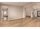 Spacious living area featuring hard wood flooring, bright lighting, and white trim throughout at 2183 W Hawken Way, Chandler, AZ 85286