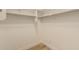 Walk-in closet equipped with shelving, rods for hanging clothes, and an uncluttered space for organized storage at 2183 W Hawken Way, Chandler, AZ 85286