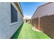 Cozy backyard featuring synthetic grass and block wall fencing for privacy at 22721 N 34Th St, Phoenix, AZ 85050