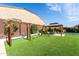 Backyard with a playground, gazebo and artificial grass, perfect for outdoor fun and relaxation at 22721 N 34Th St, Phoenix, AZ 85050
