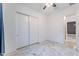 Bedroom featuring tile floors, large closet, and entry to the ensuite bathroom at 22721 N 34Th St, Phoenix, AZ 85050